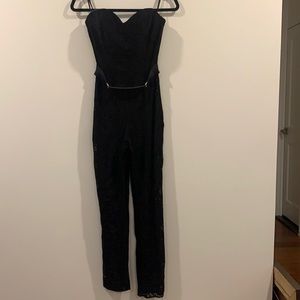 Black lace Bebe jumpsuit with gold belt
